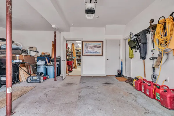 a view of a dry yard with wooden floor and fence
