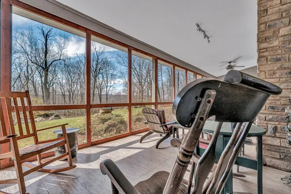 a living room with fireplace furniture and a fireplace