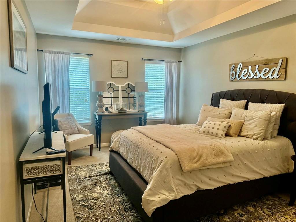 417 Farmwood Way Canton, GA 30115 - Photo 15 of 20 a bedroom with a bed and wooden floor