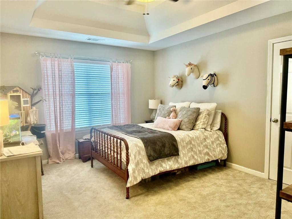 417 Farmwood Way Canton, GA 30115 - Photo 16 of 20 a bedroom with a bed and a window