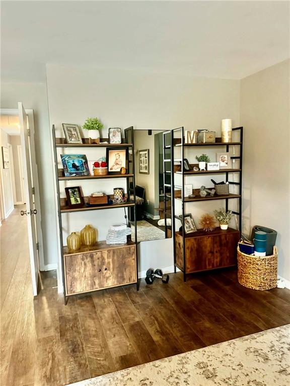 417 Farmwood Way Canton, GA 30115 - Photo 17 of 20 a living room with furniture and a book shelf