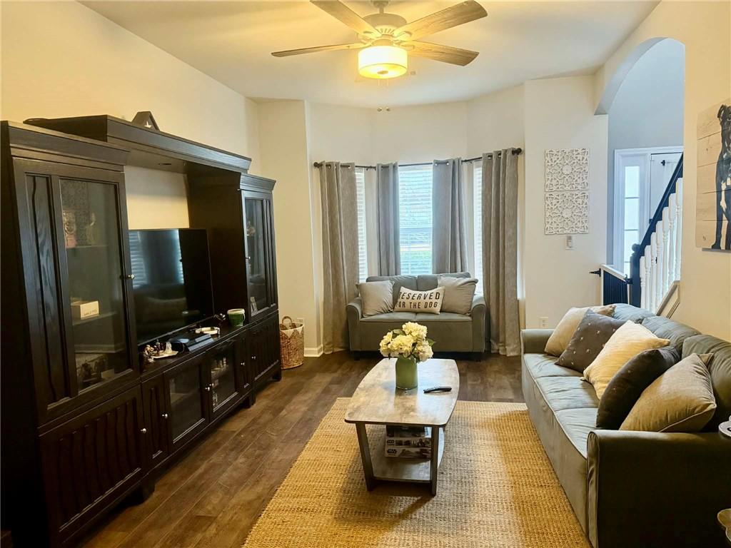 417 Farmwood Way Canton, GA 30115 - Photo 2 of 20 a living room with furniture and a flat screen tv
