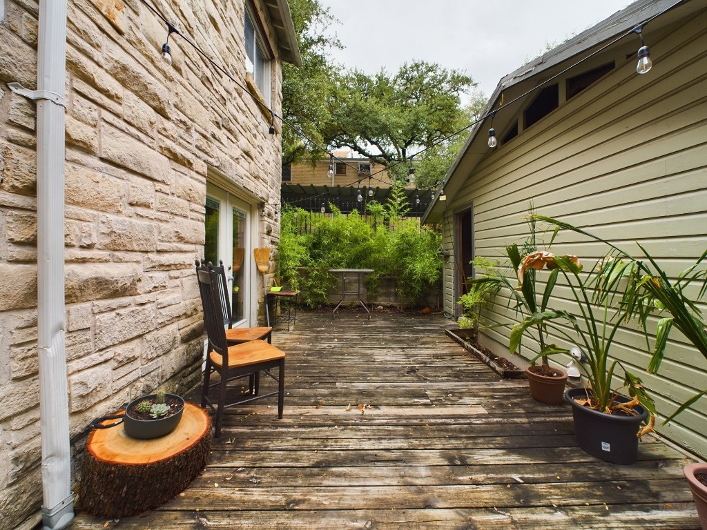 915 Keith Lane, Unit 103 Austin, TX 78705 - Photo 15 of 17 a view of an outdoor sitting area with brick walls