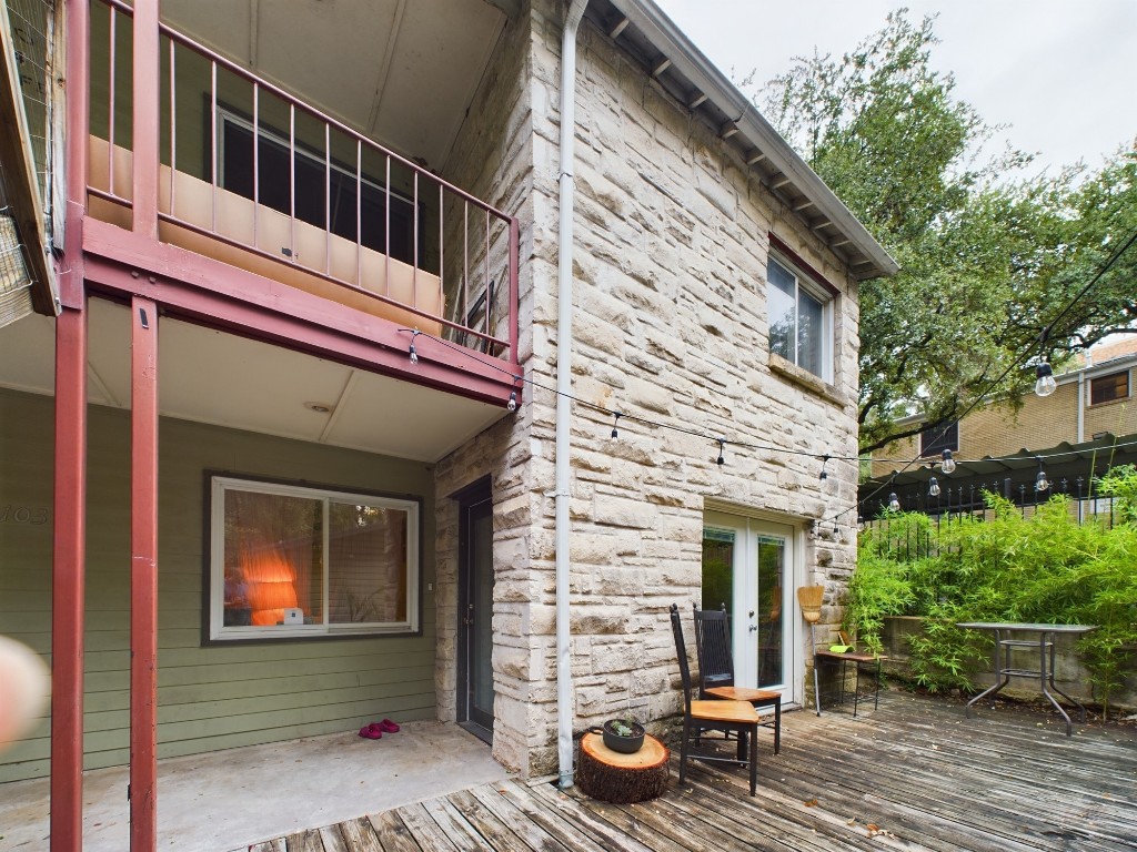 915 Keith Lane, Unit 103 Austin, TX 78705 - Photo 16 of 17 a front view of a house with a garden