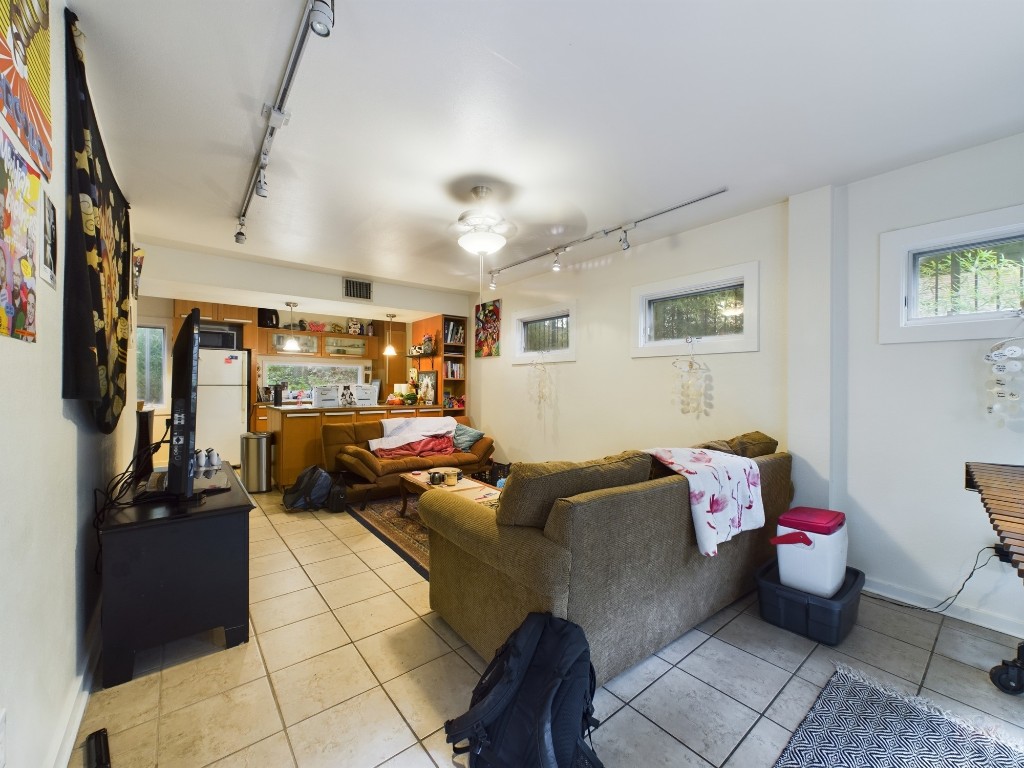 915 Keith Lane, Unit 103 Austin, TX 78705 - Photo 3 of 17 a living room with furniture and a window