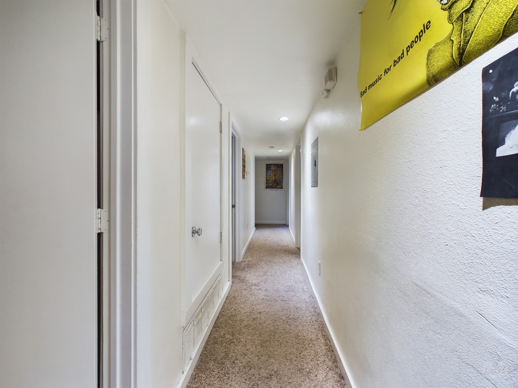 915 Keith Lane, Unit 103 Austin, TX 78705 - Photo 7 of 17 a view of a hallway with wooden floor