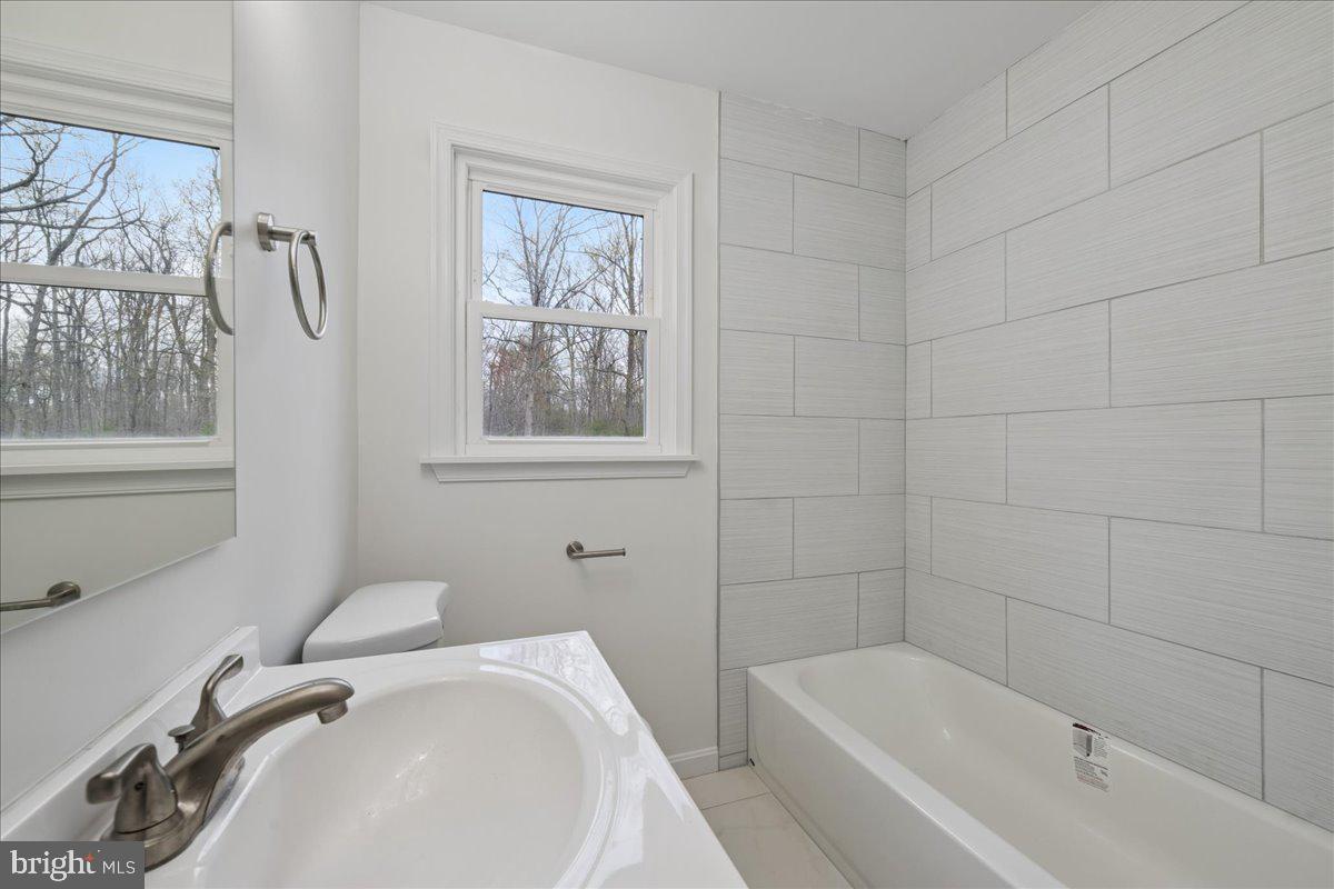 16206 Ashbox Road Brandywine, MD 20613 - Photo 30 of 30 Bright and airy modern bathroom retreat.