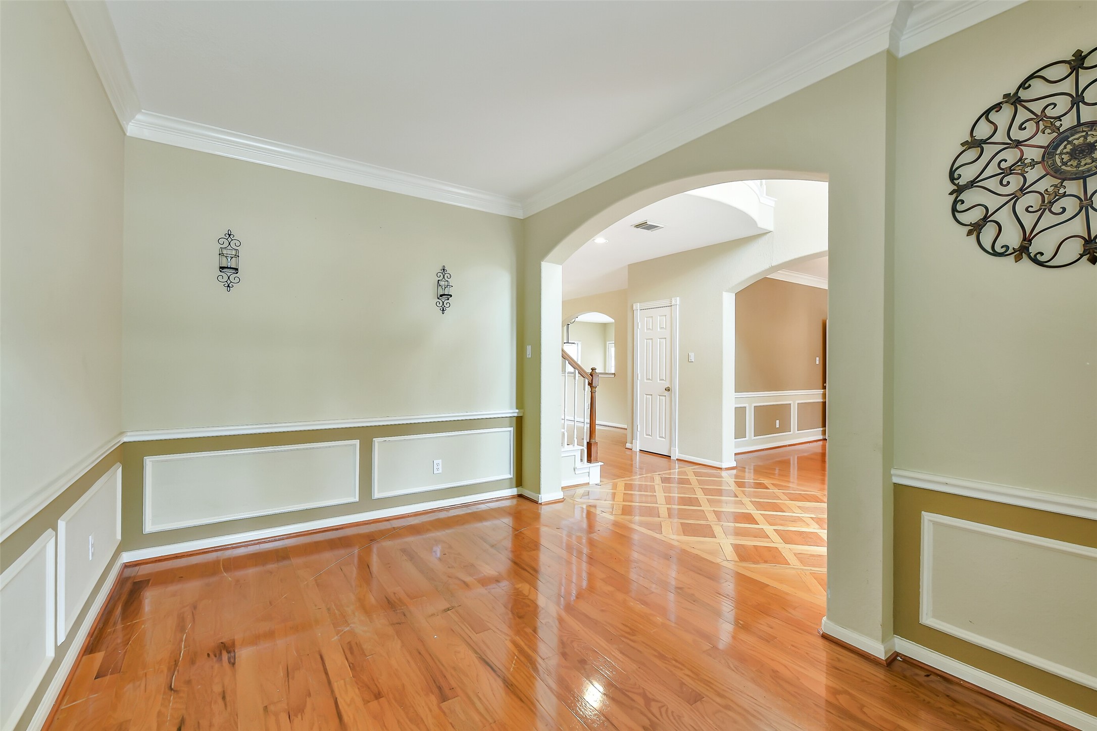 5803 Song Ridge Court Houston, TX 77041 - Photo 16 of 45 a view of an empty room with wooden floor