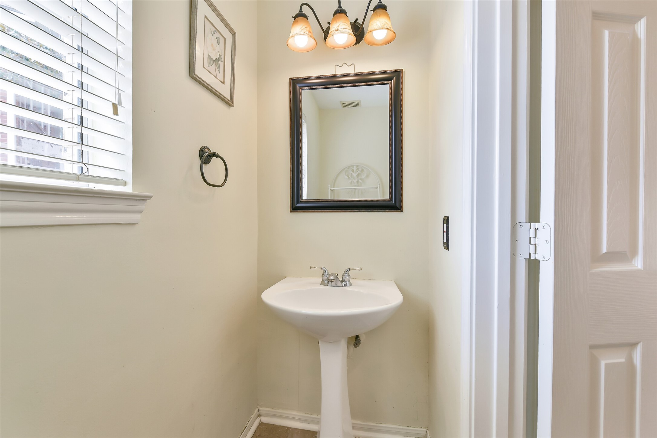 5803 Song Ridge Court Houston, TX 77041 - Photo 17 of 45 a bathroom with a sink and a mirror