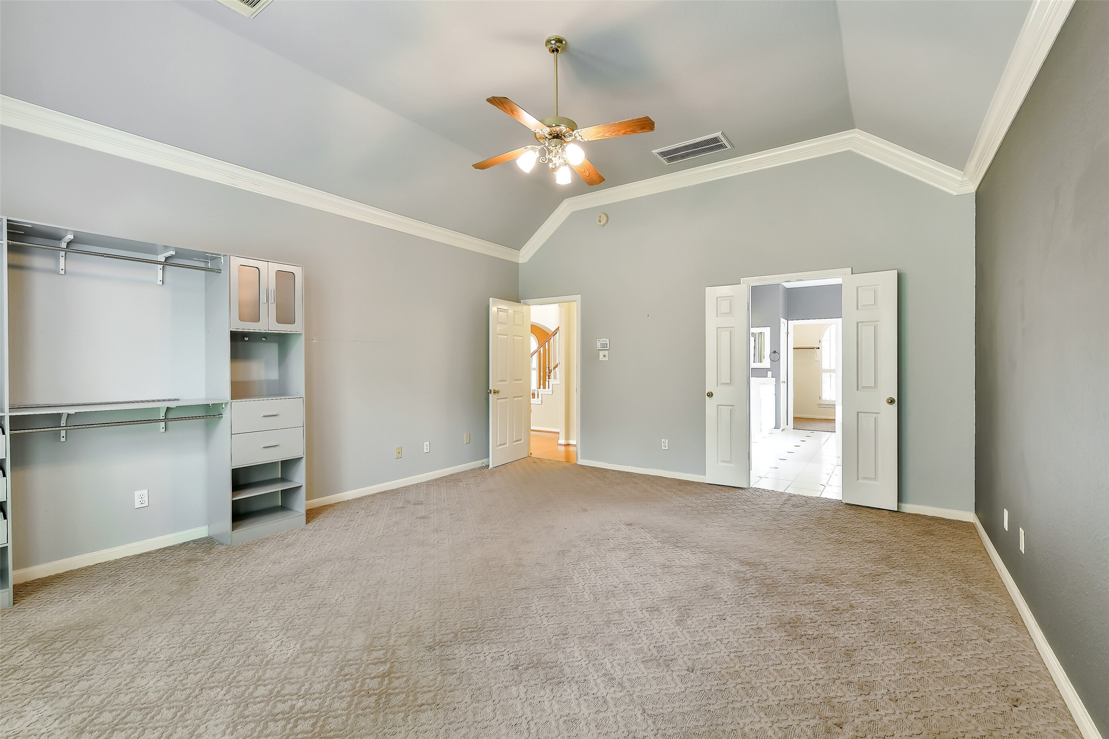 5803 Song Ridge Court Houston, TX 77041 - Photo 19 of 45 a view of an empty room with a ceiling fan