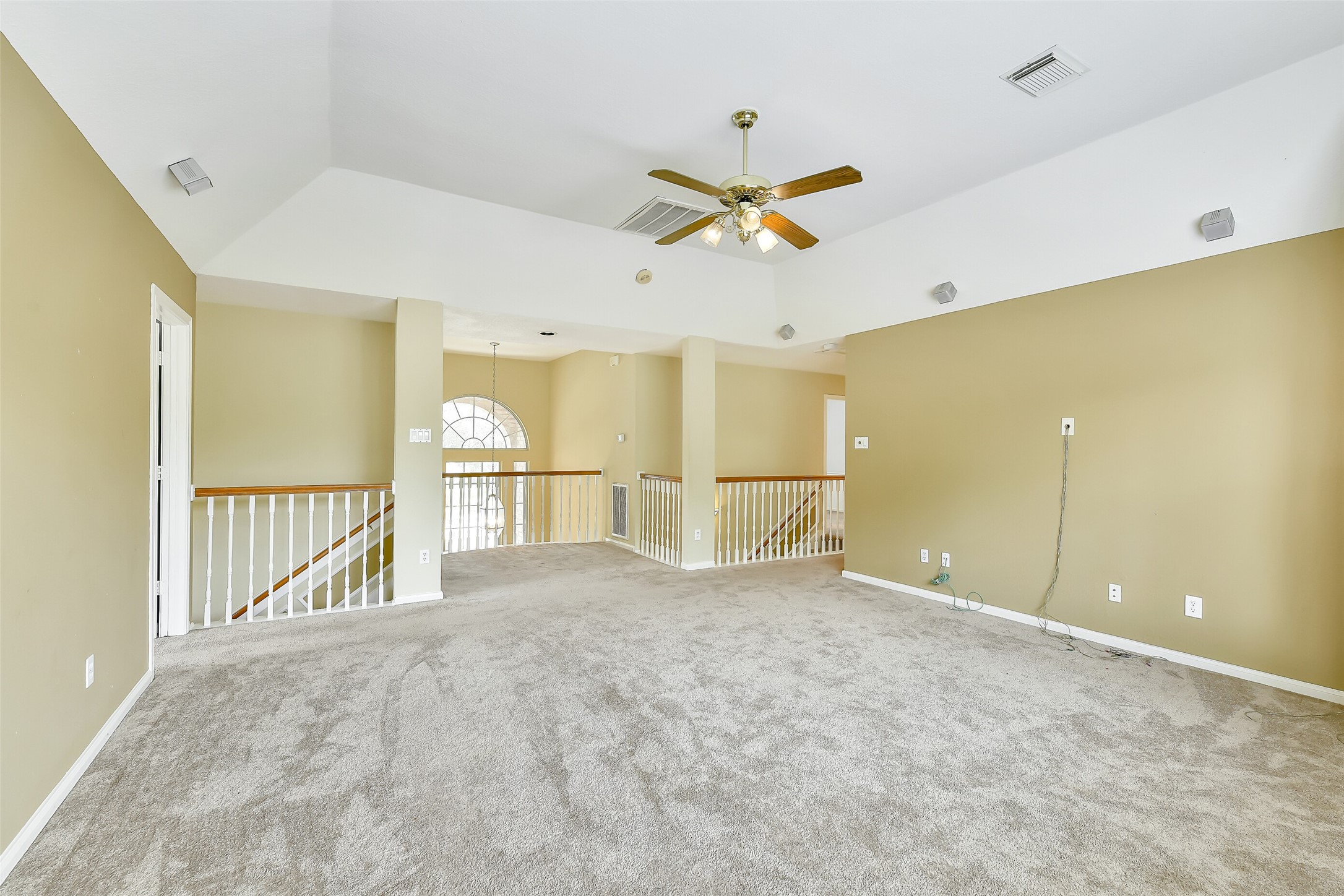 5803 Song Ridge Court Houston, TX 77041 - Photo 27 of 45 a view of a livingroom with a ceiling fan and kitchen view