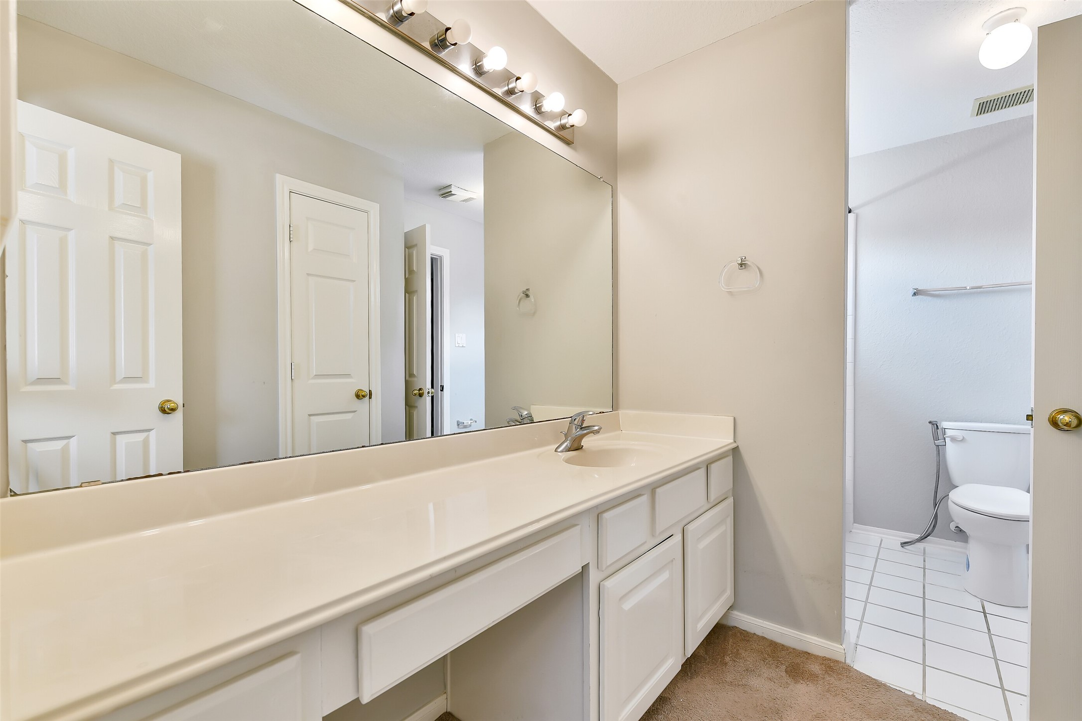 5803 Song Ridge Court Houston, TX 77041 - Photo 30 of 45 a bathroom with a sink a toilet and a mirror