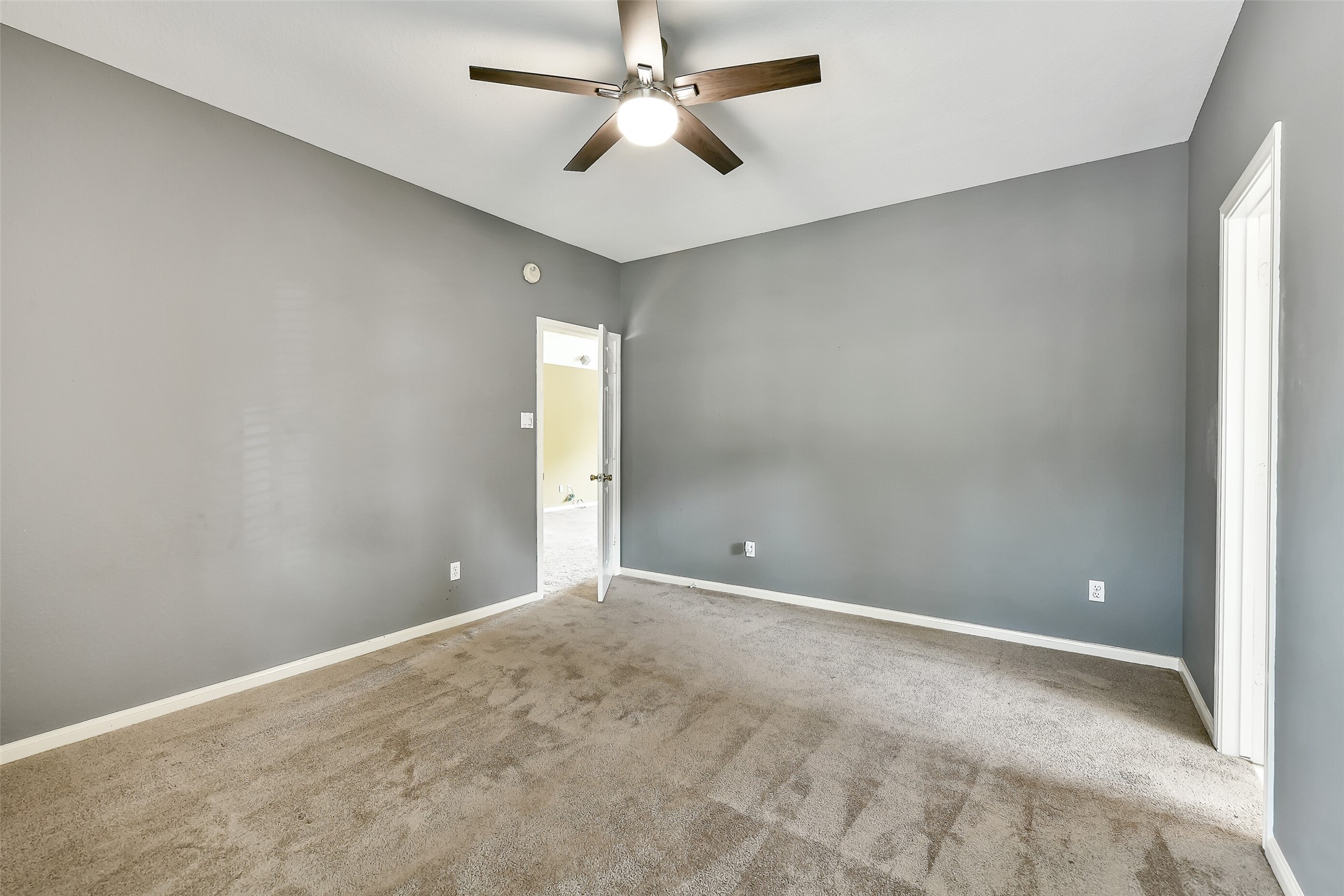 5803 Song Ridge Court Houston, TX 77041 - Photo 32 of 45 a view of an empty room and a ceiling fan