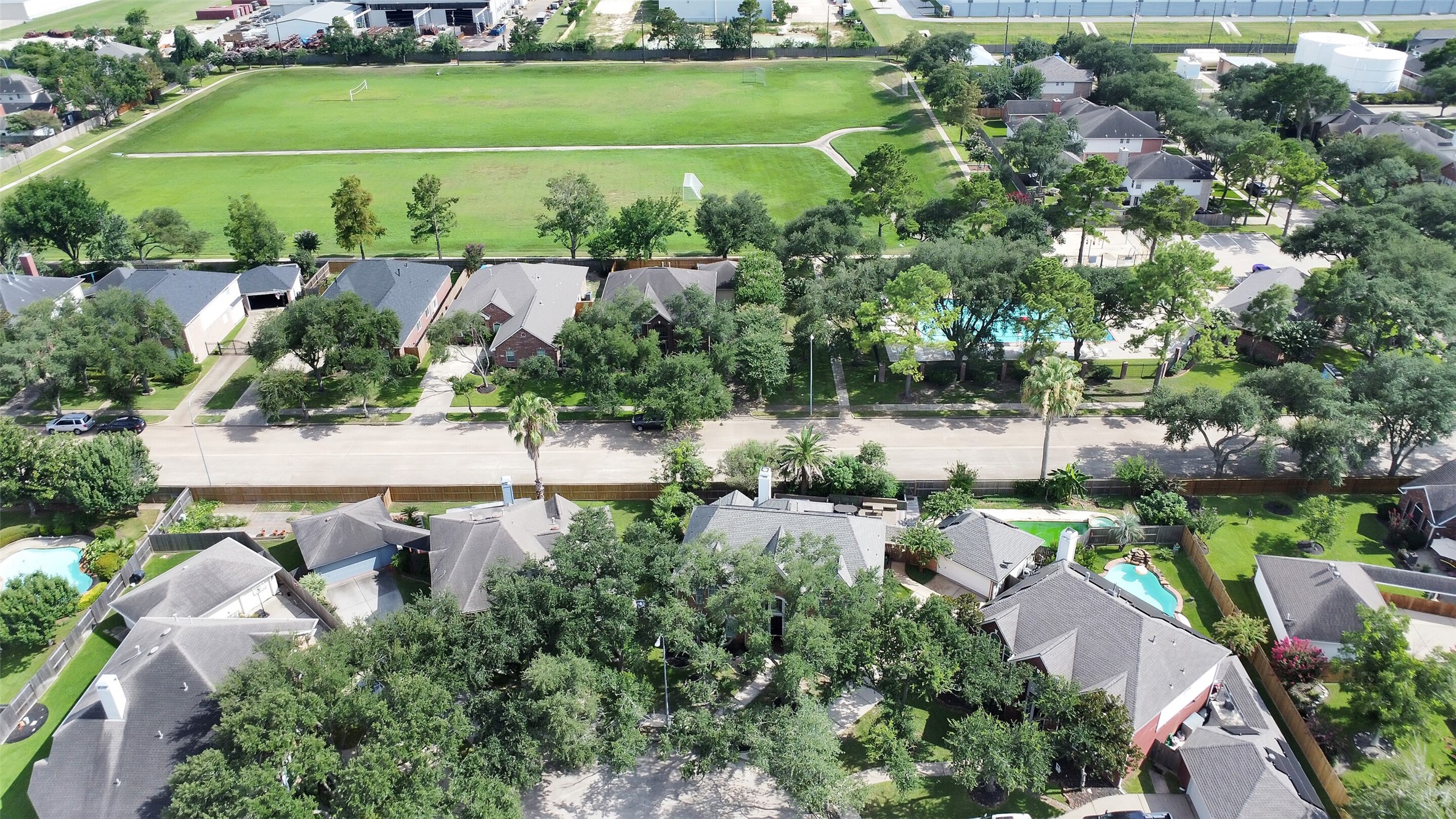 5803 Song Ridge Court Houston, TX 77041 - Photo 43 of 45 an aerial view of a house with a yard and lake view