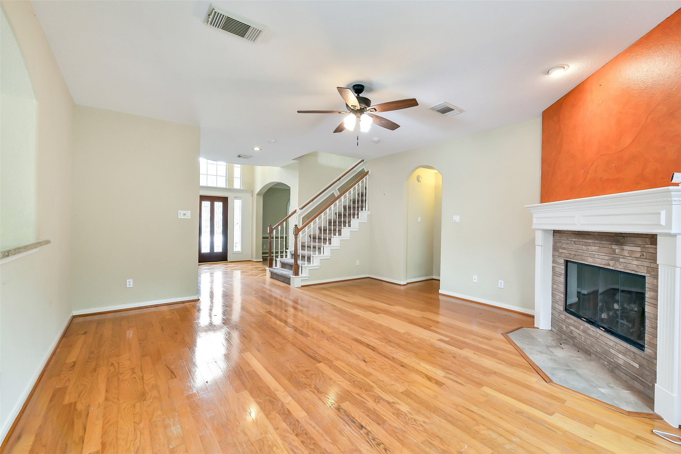 5803 Song Ridge Court Houston, TX 77041 - Photo 5 of 45 a view of empty room with wooden floor and fan