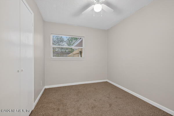 7143 King Arthur Road North Jacksonville, FL 32211 - Photo 12 of 18 an empty room with a window