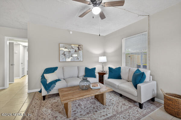 7143 King Arthur Road North Jacksonville, FL 32211 - Photo 4 of 18 a living room with furniture and a rug