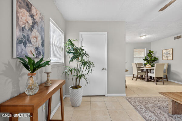 7143 King Arthur Road North Jacksonville, FL 32211 - Photo 5 of 18 a view of a room with furniture and a potted plant