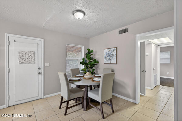 7143 King Arthur Road North Jacksonville, FL 32211 - Photo 6 of 18 a dining room with furniture and window