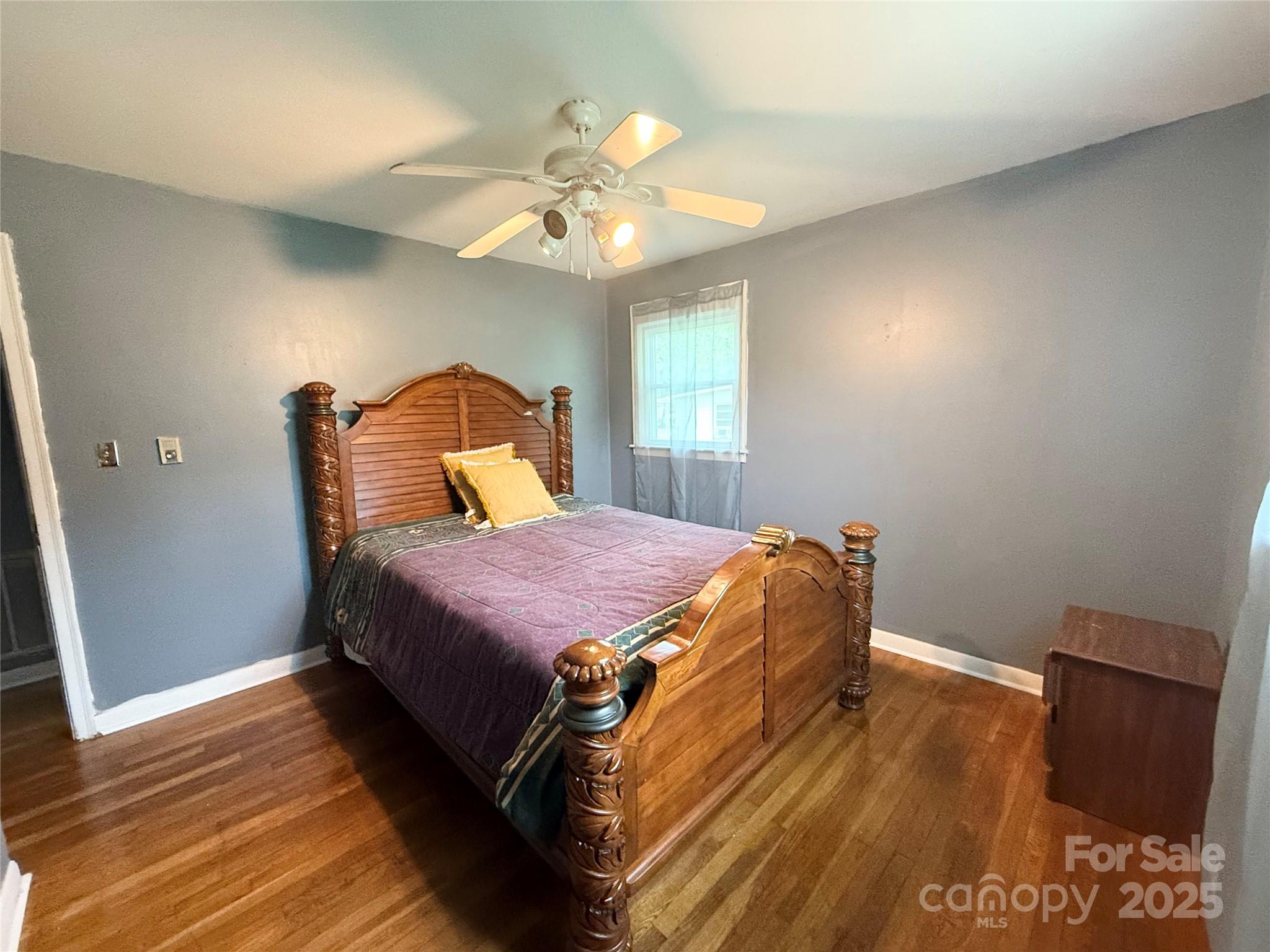 101 Windsor Drive Cheraw, SC 29520 - Photo 13 of 17 a spacious bedroom with a bed and a window