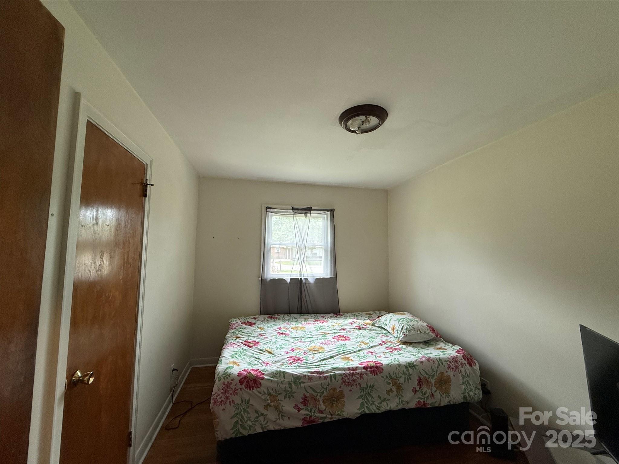 101 Windsor Drive Cheraw, SC 29520 - Photo 15 of 17 a bedroom with a bed and a window