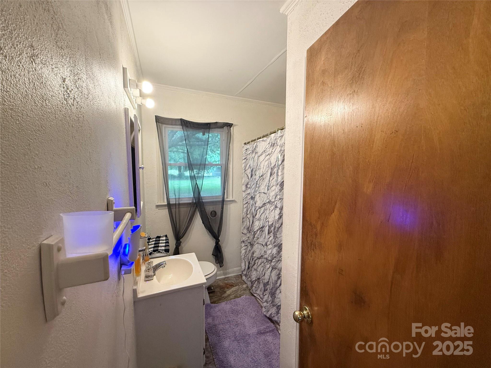 101 Windsor Drive Cheraw, SC 29520 - Photo 17 of 17 a bathroom with a sink toilet and shower