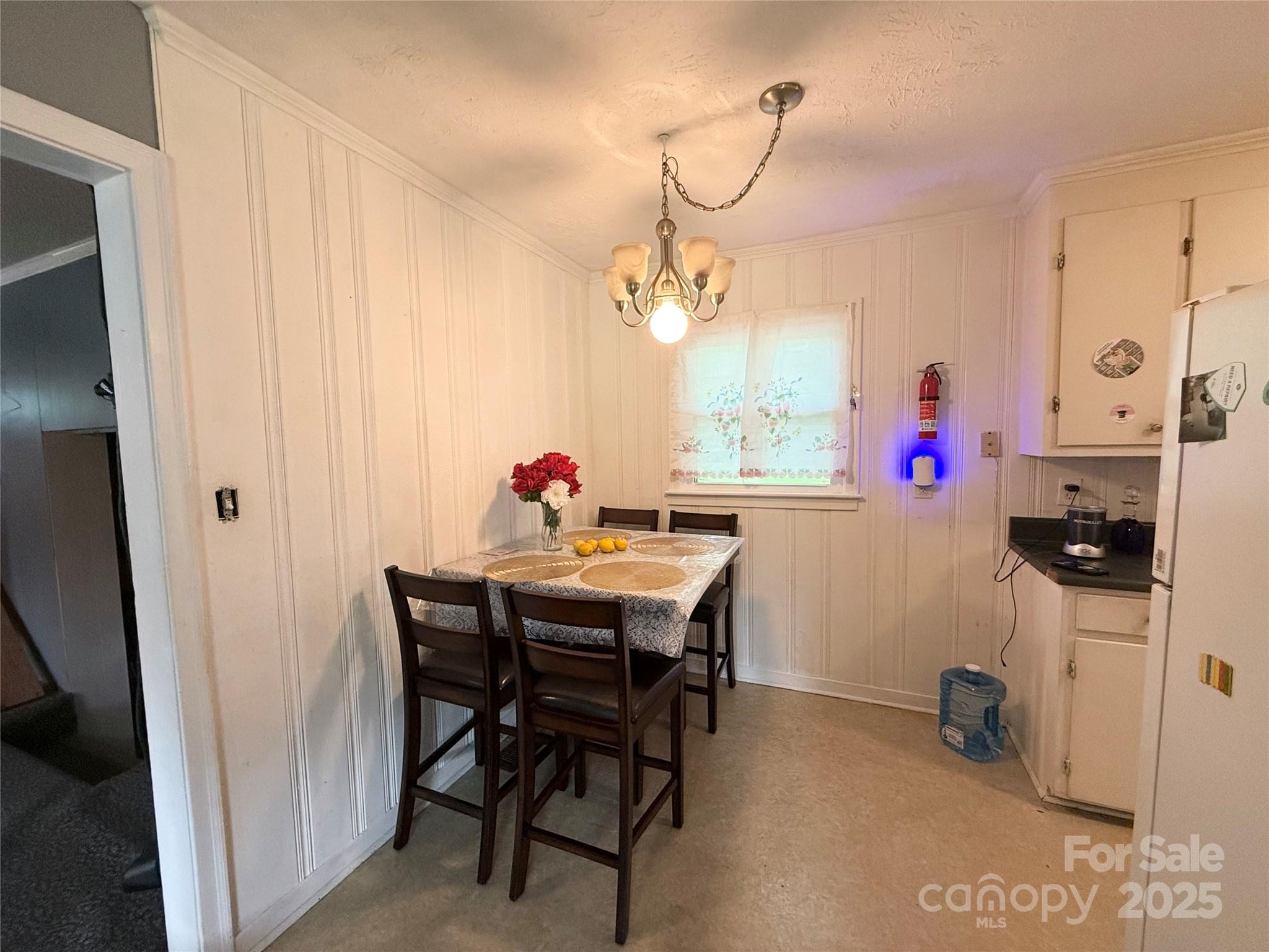 101 Windsor Drive Cheraw, SC 29520 - Photo 10 of 17 a view of a dining room with furniture and chandelier