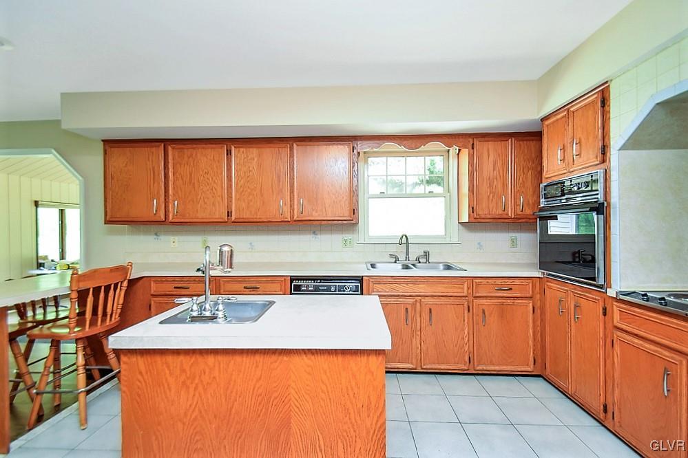 116 South Penn Dixie Road Nazareth, PA 18064 - Photo 8 of 12 a kitchen with a sink a stove and a refrigerator