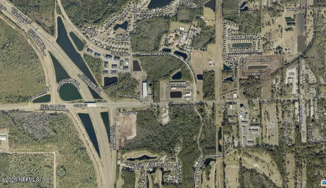 a aerial view of a house with a yard