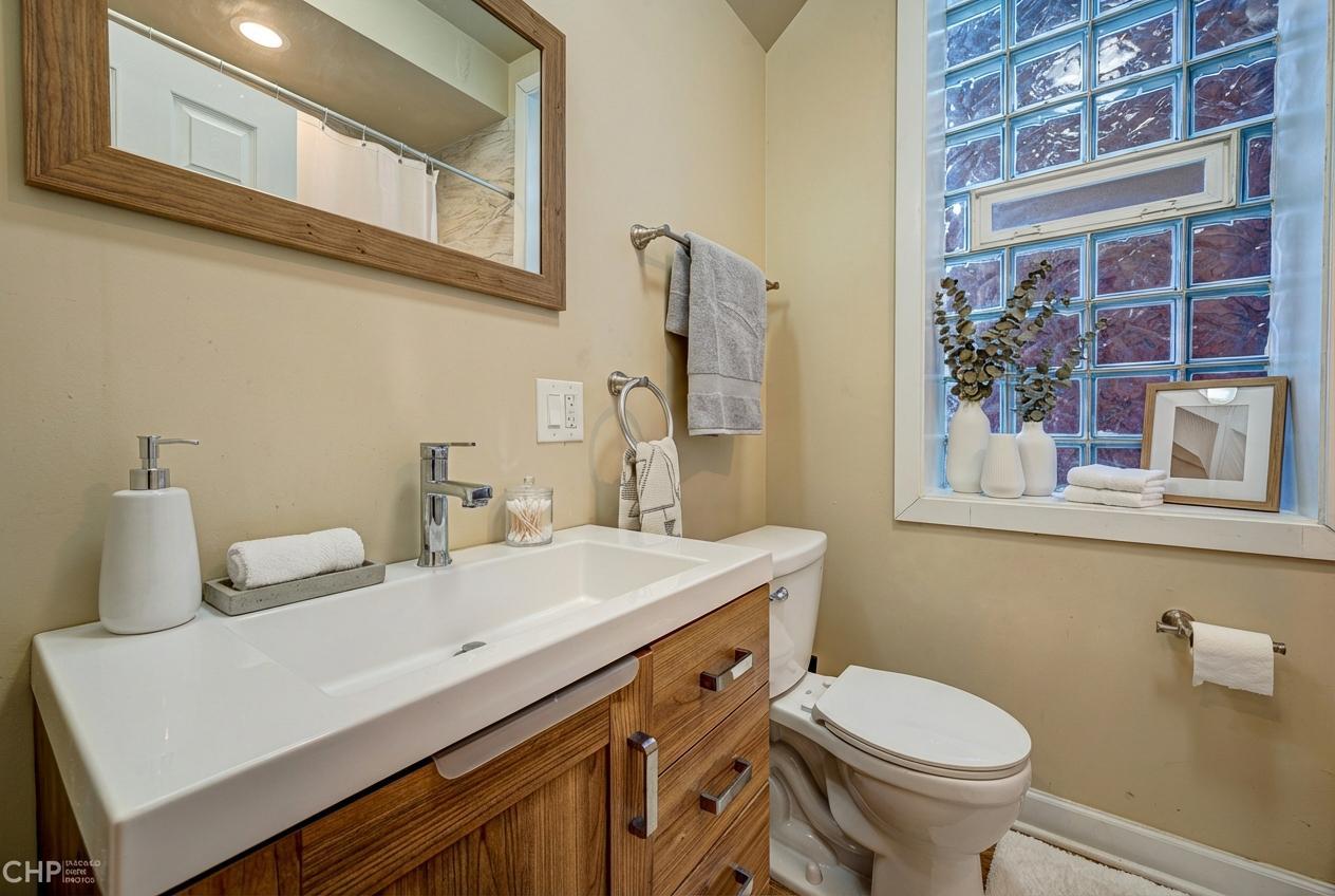 1716 South Clinton Street Chicago, IL 60616 - Photo 9 of 18 a bathroom with a sink and a toilet