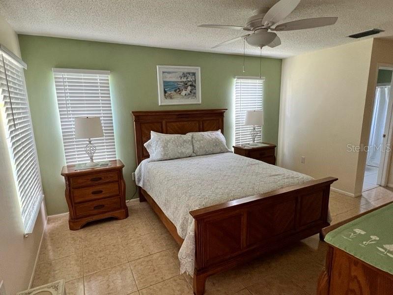 Undisclosed Address Bradenton, FL 34209 - Photo 16 of 38 a bedroom with a bed and a window
