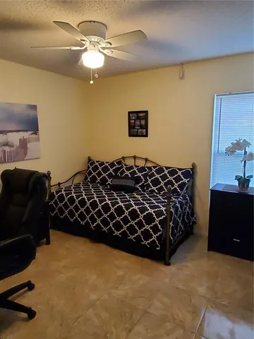 a bedroom with a bed and a piano