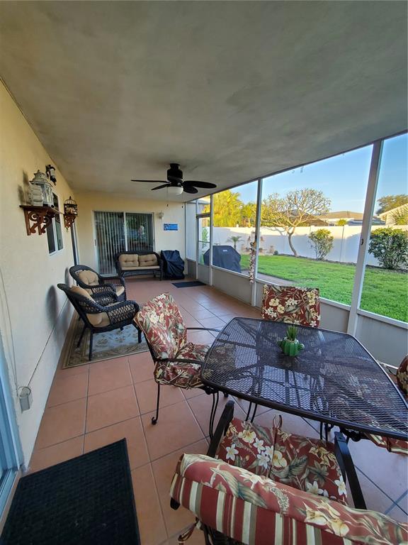 Undisclosed Address Bradenton, FL 34209 - Photo 29 of 38 a living room with furniture and a floor to ceiling window