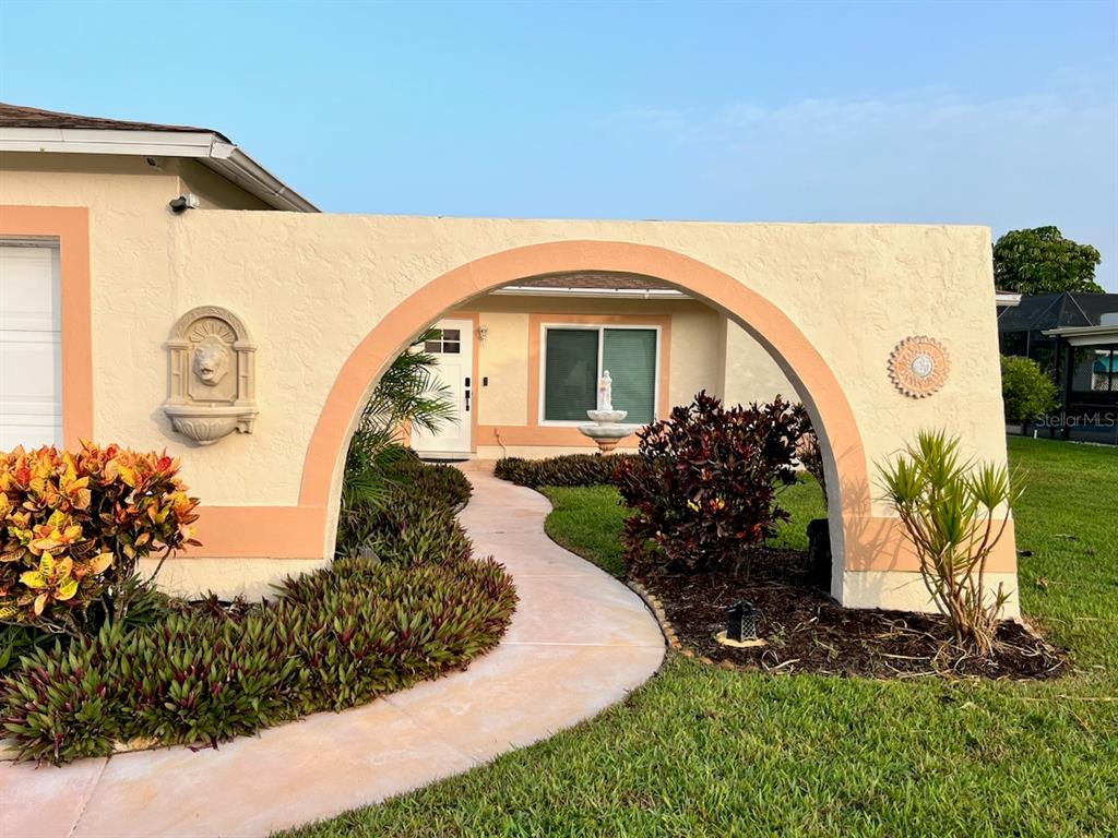 Undisclosed Address Bradenton, FL 34209 - Photo 36 of 38 a front view of a house with garden