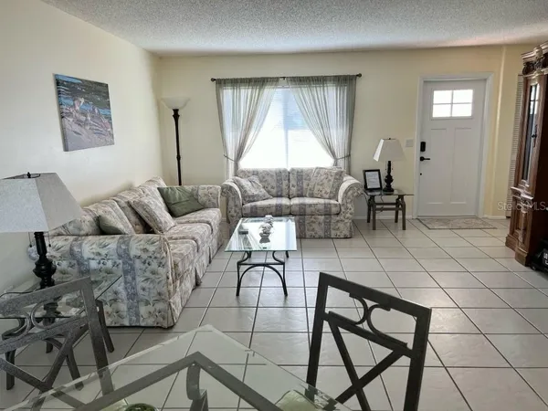 a living room with furniture and a window