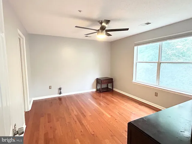 a room with a bed and a window