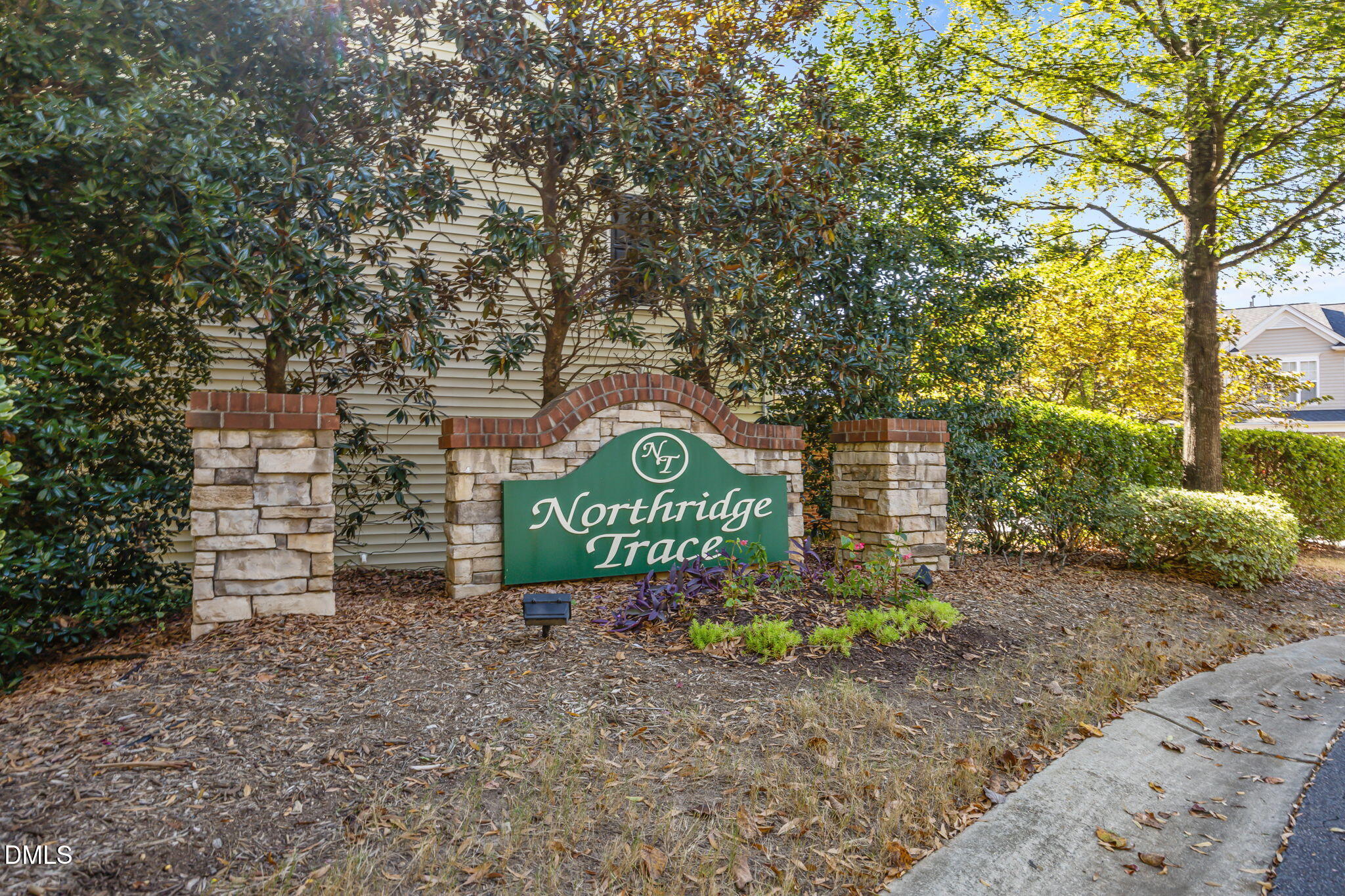 7008 Racine Way Raleigh, NC 27690 - Photo 16 of 36 a sign on the side of a road