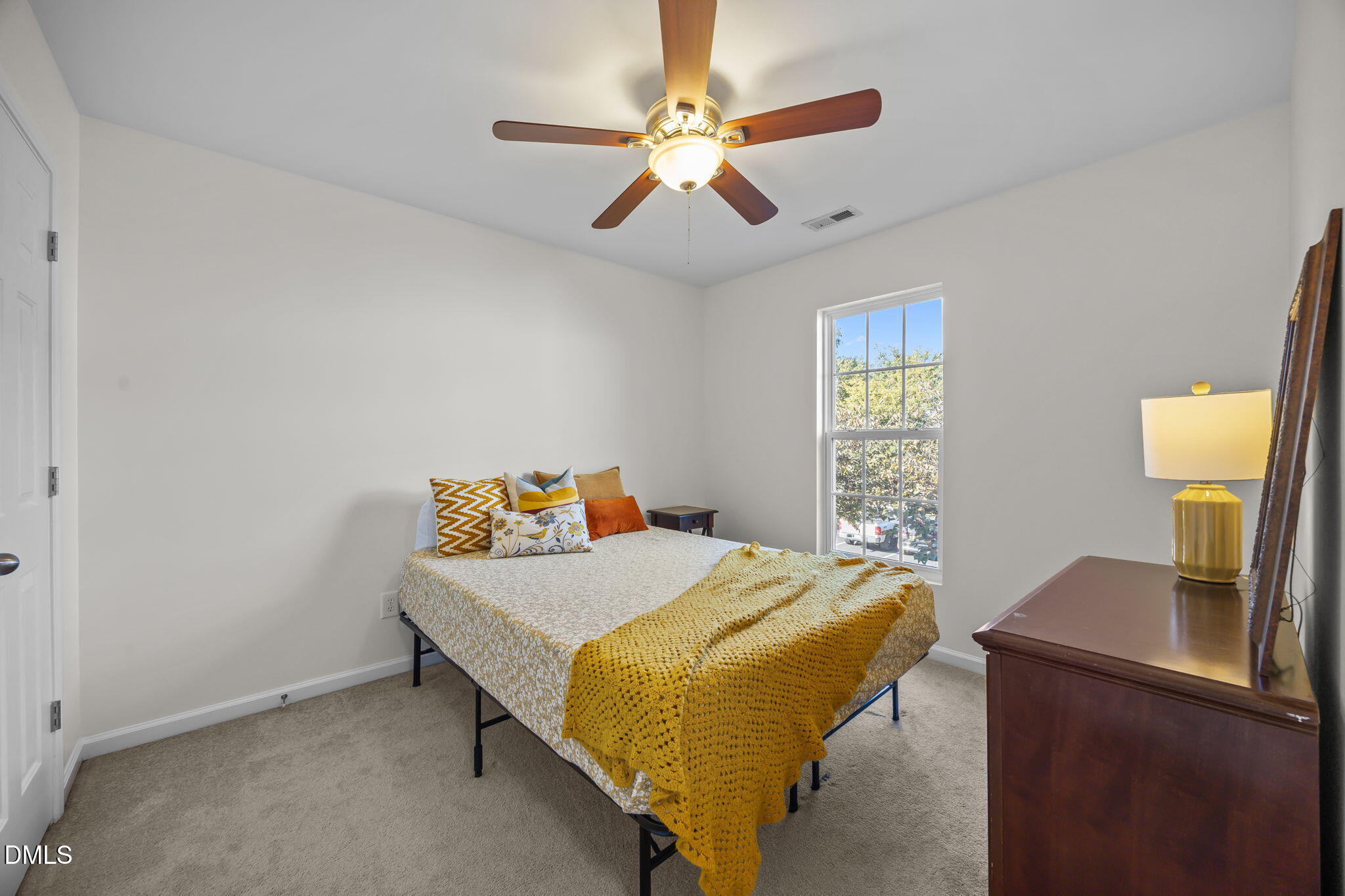 7008 Racine Way Raleigh, NC 27690 - Photo 25 of 36 a bedroom with a bed and a desk