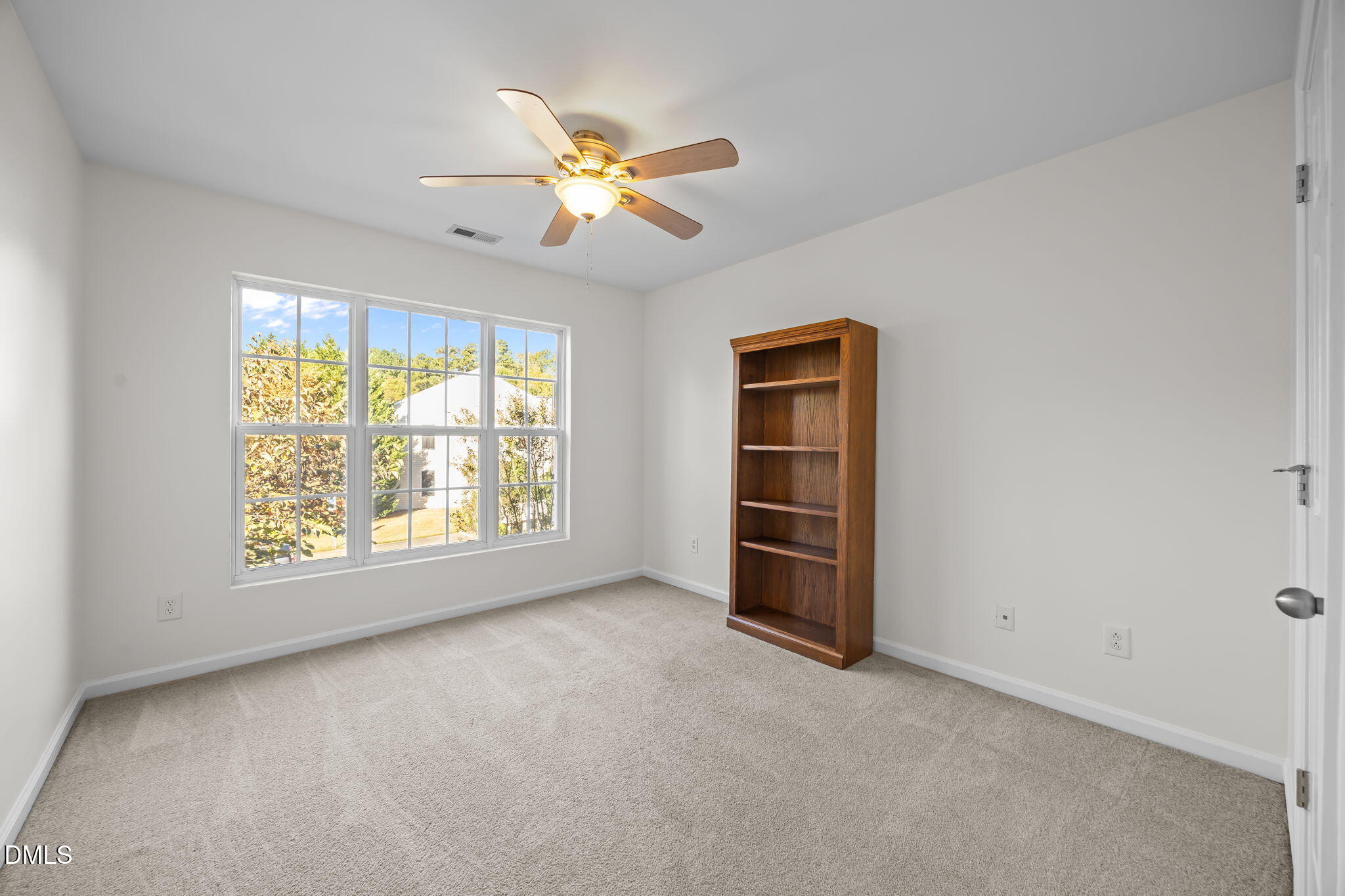 7008 Racine Way Raleigh, NC 27690 - Photo 26 of 36 a view of an empty room with a window