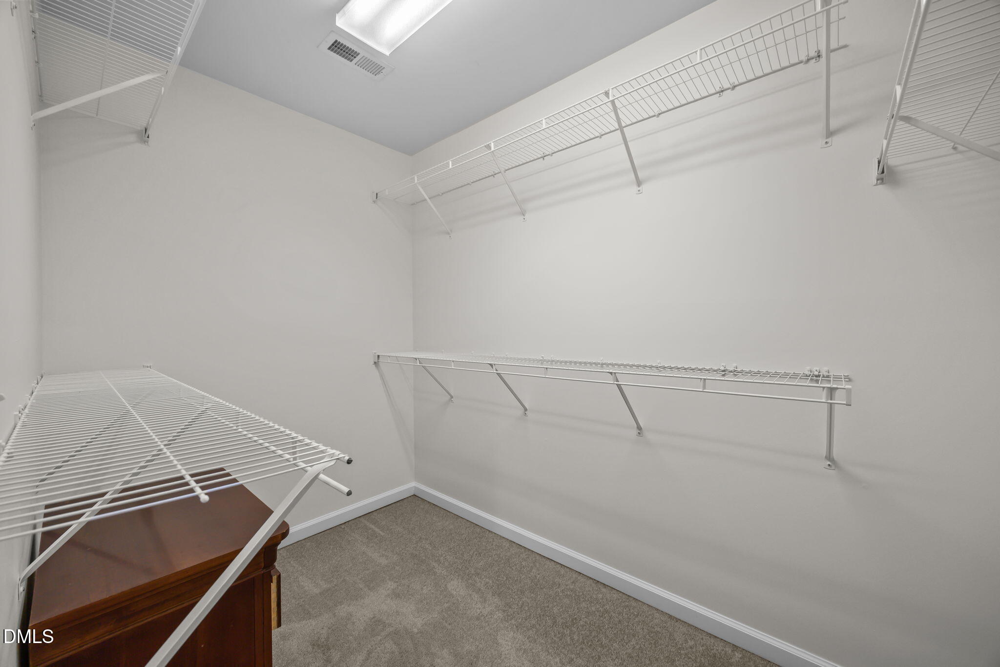 7008 Racine Way Raleigh, NC 27690 - Photo 30 of 36 a view of storage and utility room with racks on the wall