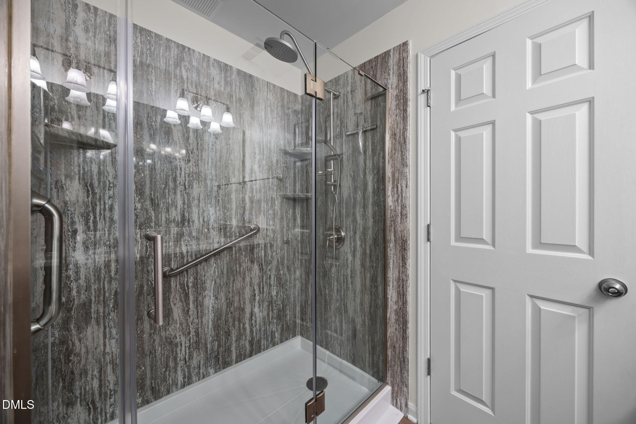 7008 Racine Way Raleigh, NC 27690 - Photo 32 of 36 a bathroom with a shower and a sink