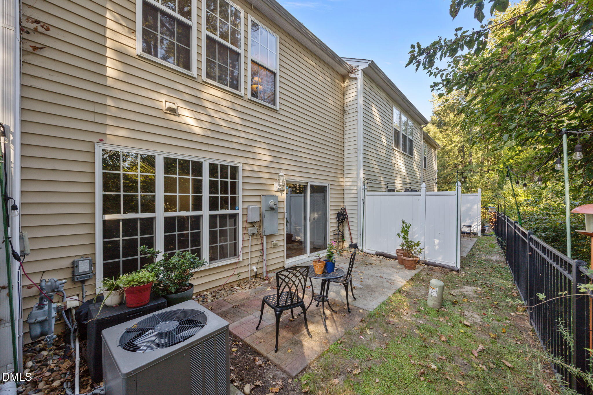 7008 Racine Way Raleigh, NC 27690 - Photo 9 of 36 a backyard of a house with table and chairs