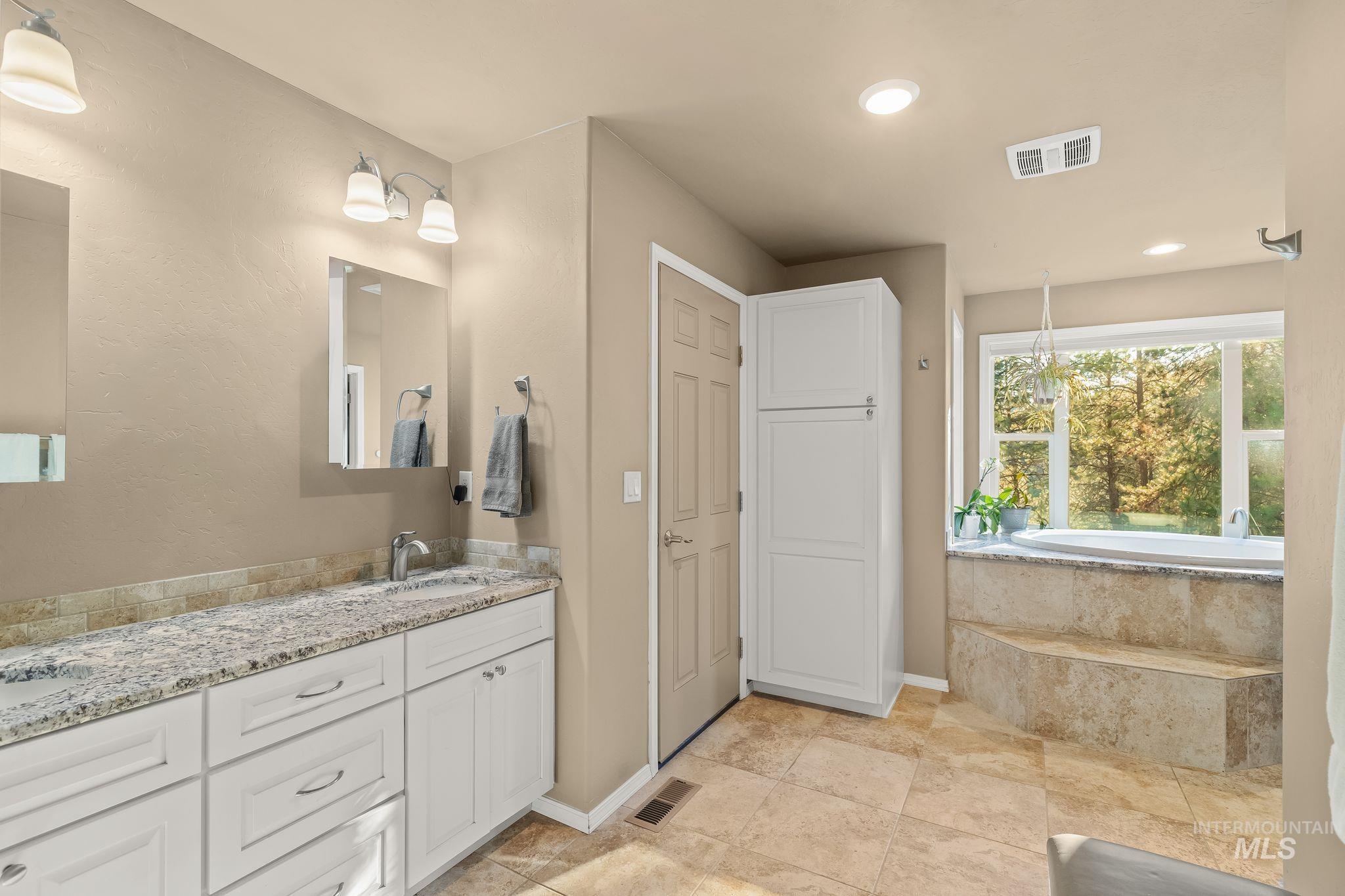 435 River Pointe Lane Lenore, ID 83541 - Photo 19 of 50 Bedroom featuring a white framed window, neutral wall paint, white trim, and a flush mount ceiling light