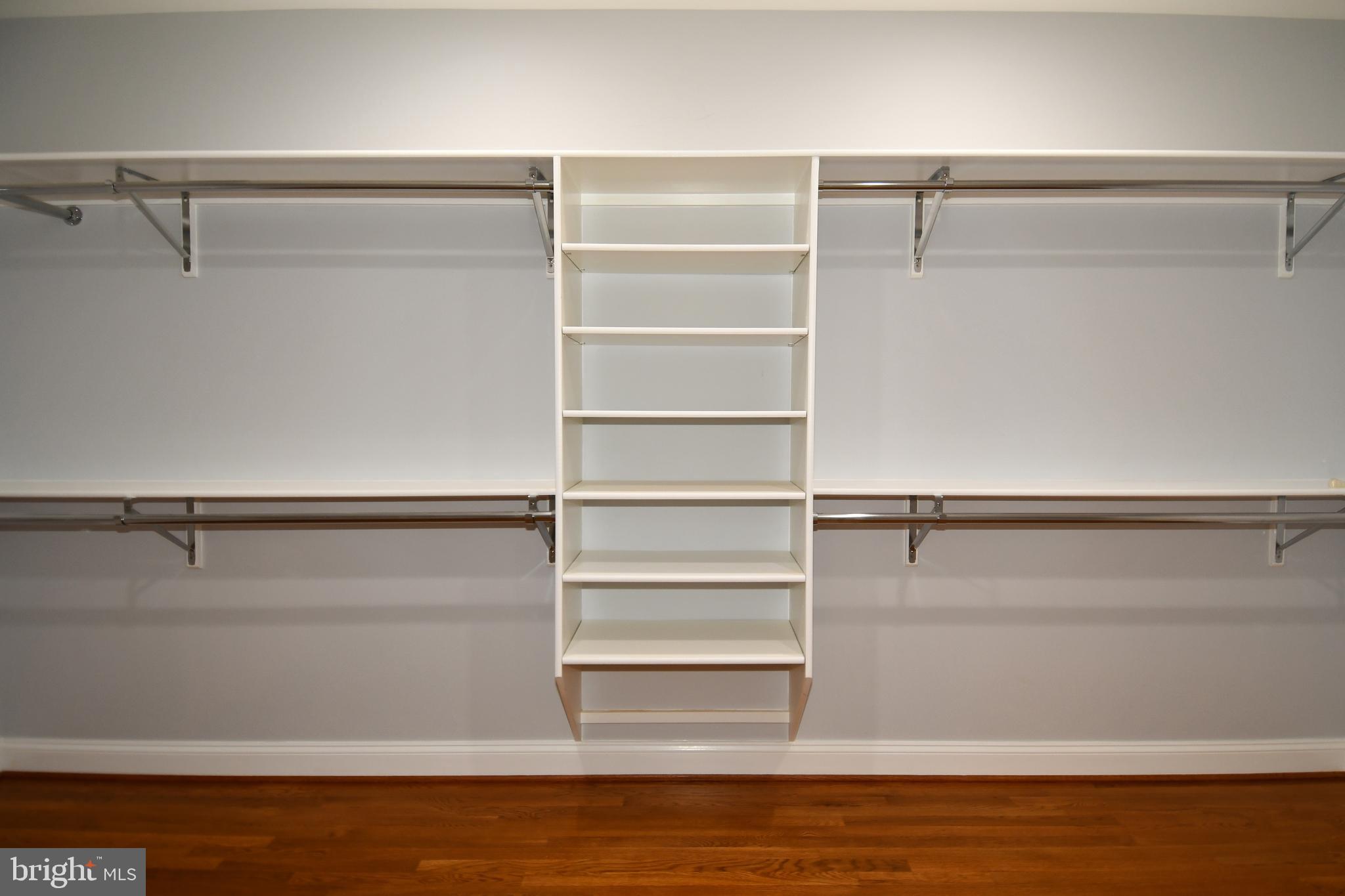 7808 Southdown Road Alexandria, VA 22308 - Photo 70 of 99 a view of walk in closet with empty racks