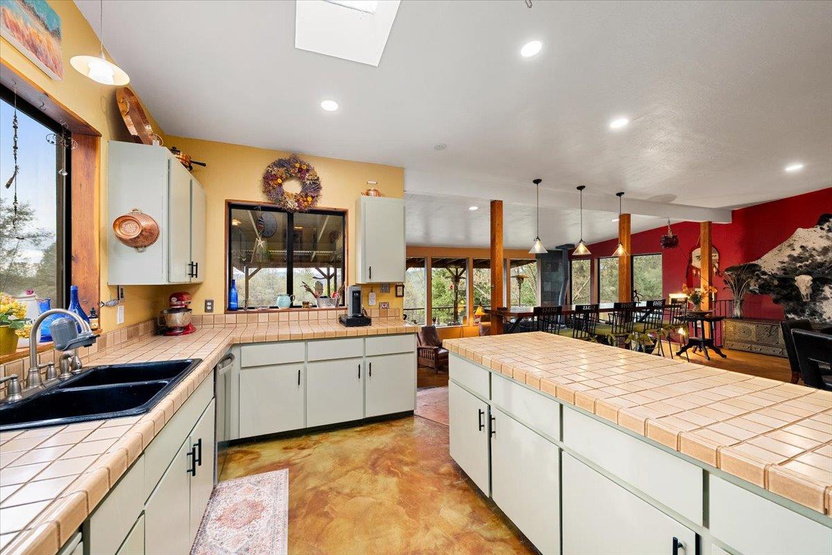 2244 Windmill Court Cool, CA 95614 - Photo 14 of 73 a large kitchen with stainless steel appliances lots of counter top space