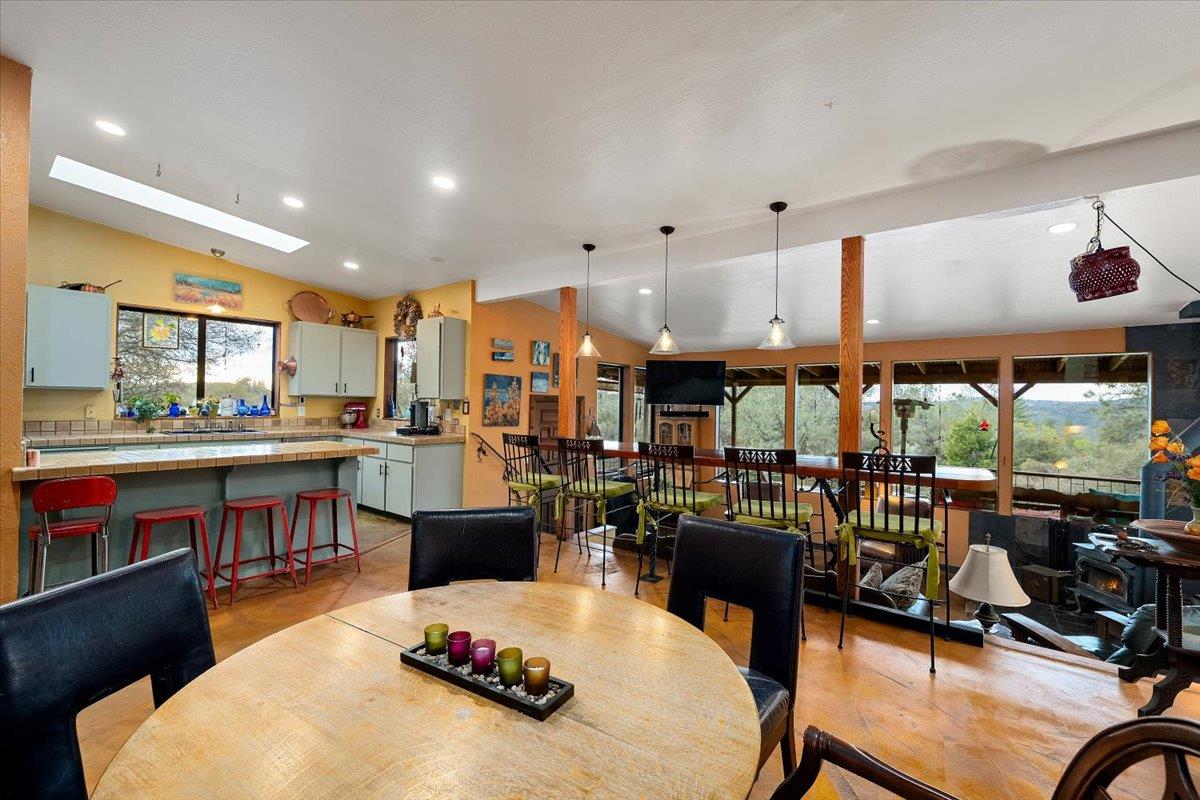 2244 Windmill Court Cool, CA 95614 - Photo 20 of 73 a living room with lots of furniture and kitchen view