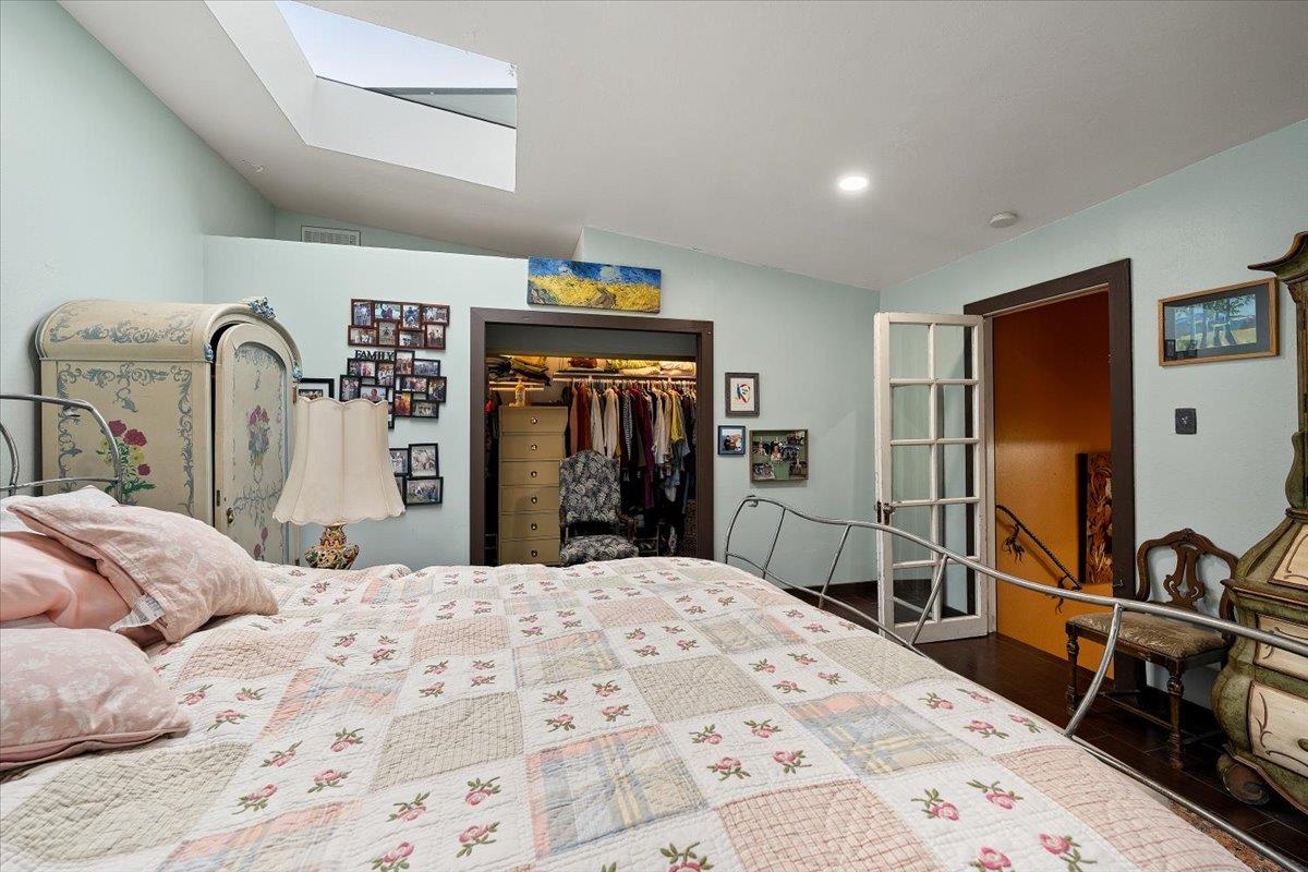 2244 Windmill Court Cool, CA 95614 - Photo 24 of 73 a bedroom with a bed and a flat tv screen tv on the dresser