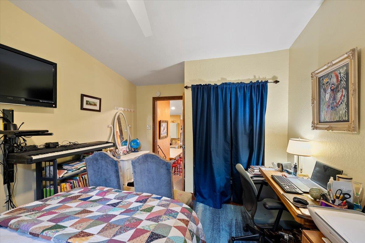 2244 Windmill Court Cool, CA 95614 - Photo 31 of 73 a bedroom with a bed and a flat screen tv