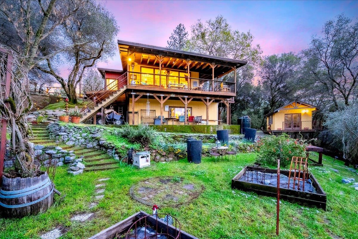 2244 Windmill Court Cool, CA 95614 - Photo 39 of 73 a front view of house with a garden and swimming pool