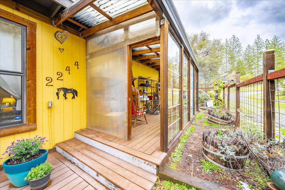 2244 Windmill Court Cool, CA 95614 - Photo 47 of 73 a balcony with wooden floor table and chairs